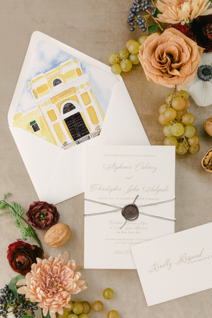 custom minimalist taupe wedding invitation suite on a brown background