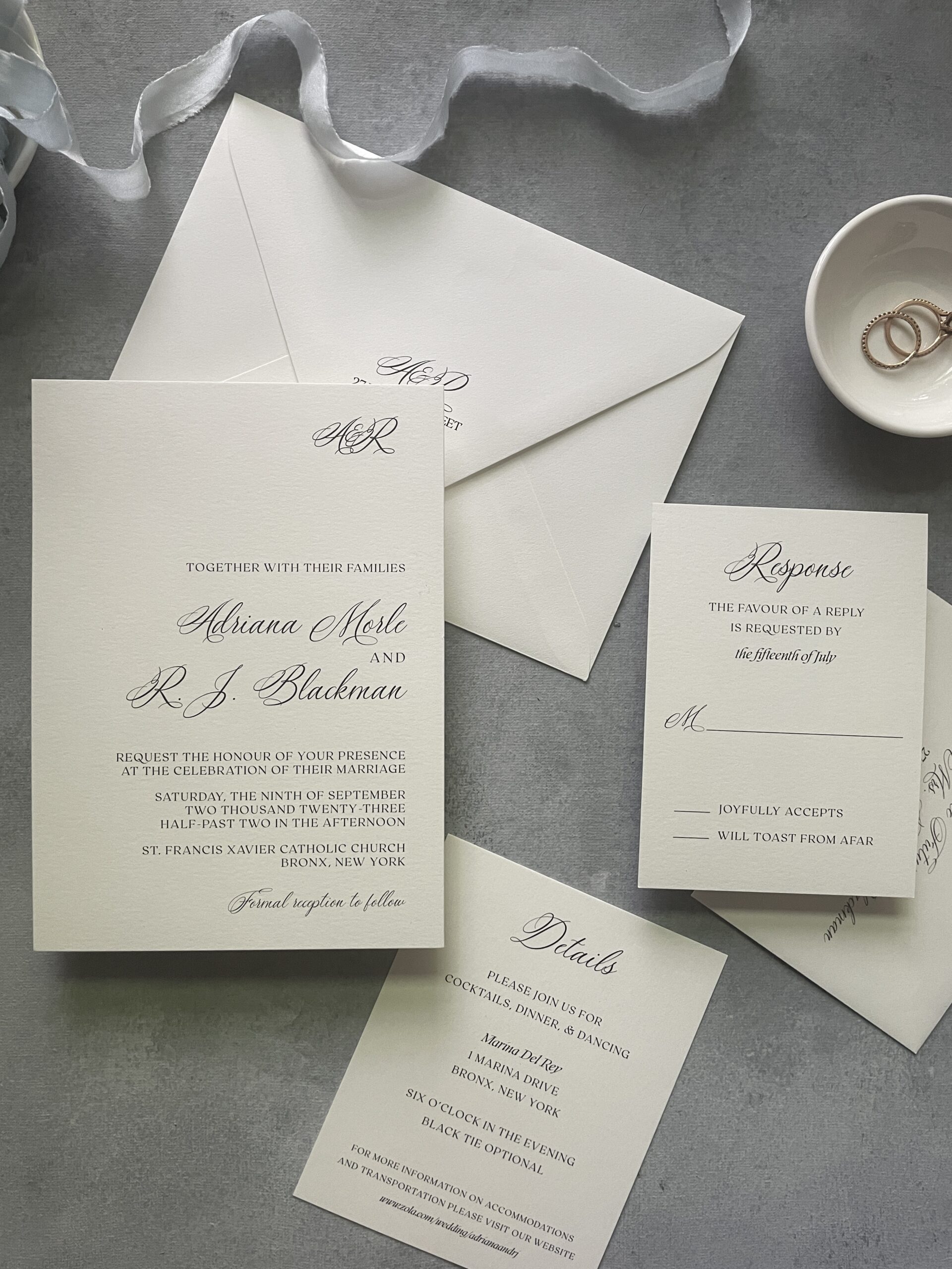 classic wedding invitation suite on a blue background